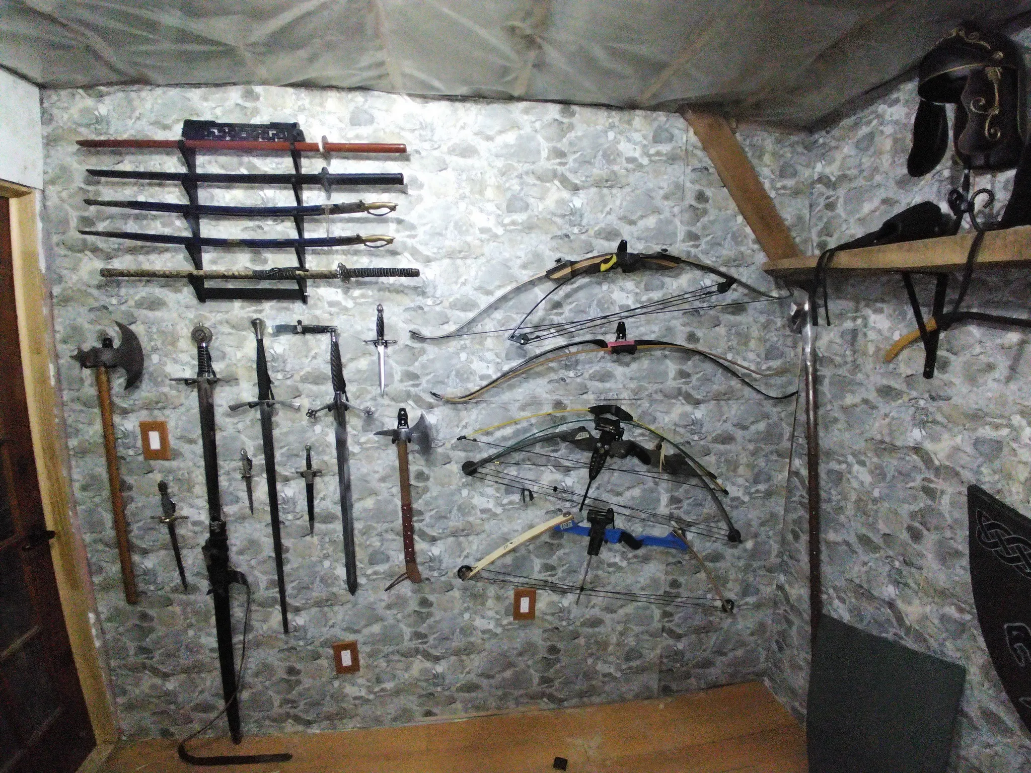 Wall of swords, axes and bows
