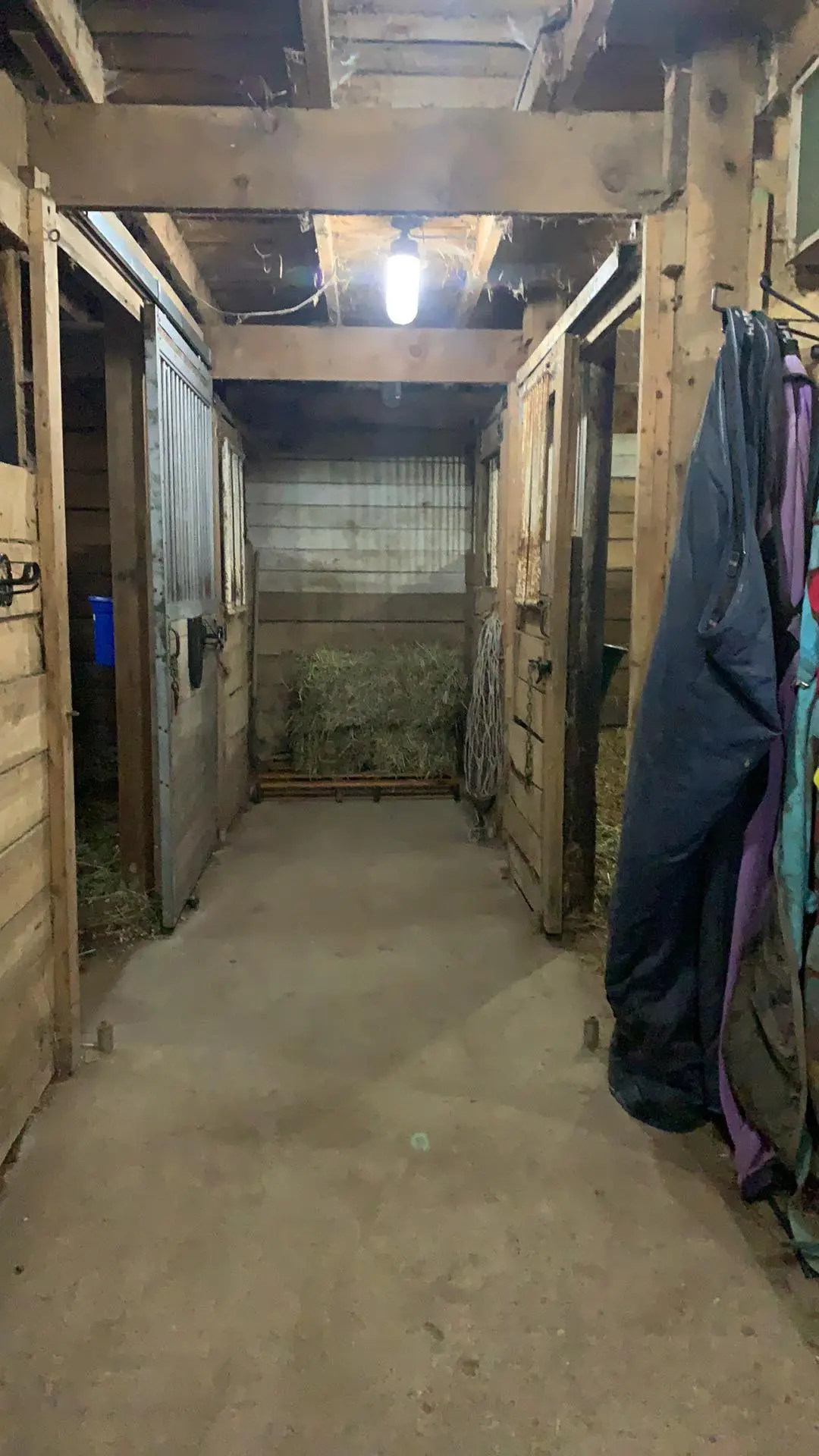 Stall Aisle with hay stored at end